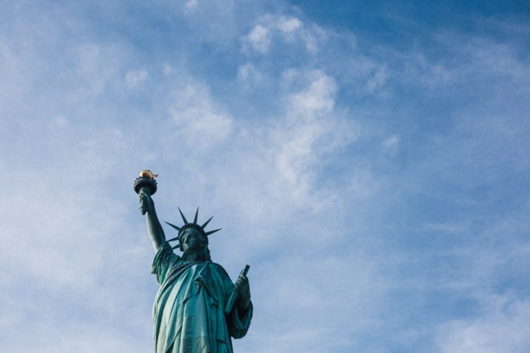 Image of the Statue of liberty posed against a blue sky. Robertson Law, LLC family immigration attorney