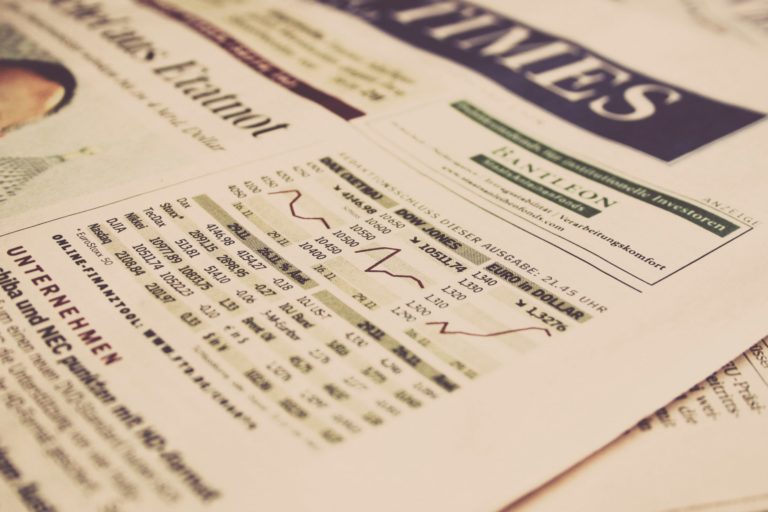 Closeup image of a newspaper with stock prices listed