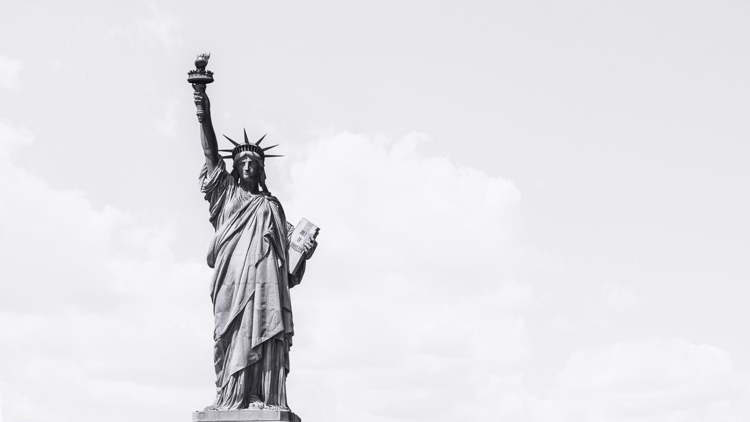 High contrast image of the statue of liberty against a clear sky