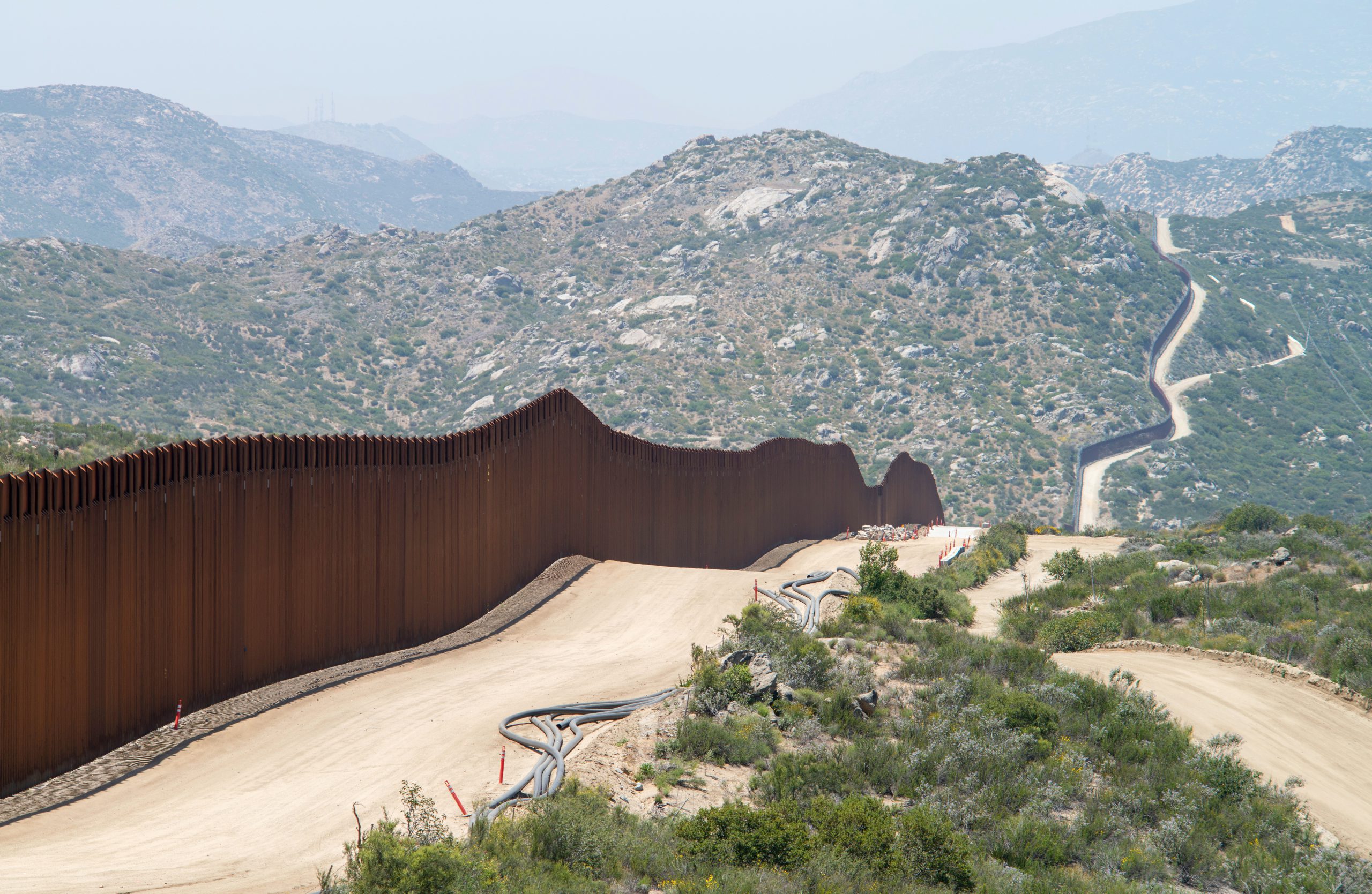 Image of the border wall separating Mexico and the US in California
