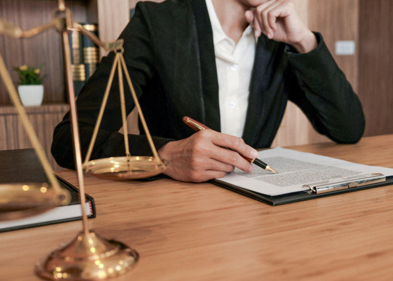 Image of an Immigration Lawyer conducting business at a desk