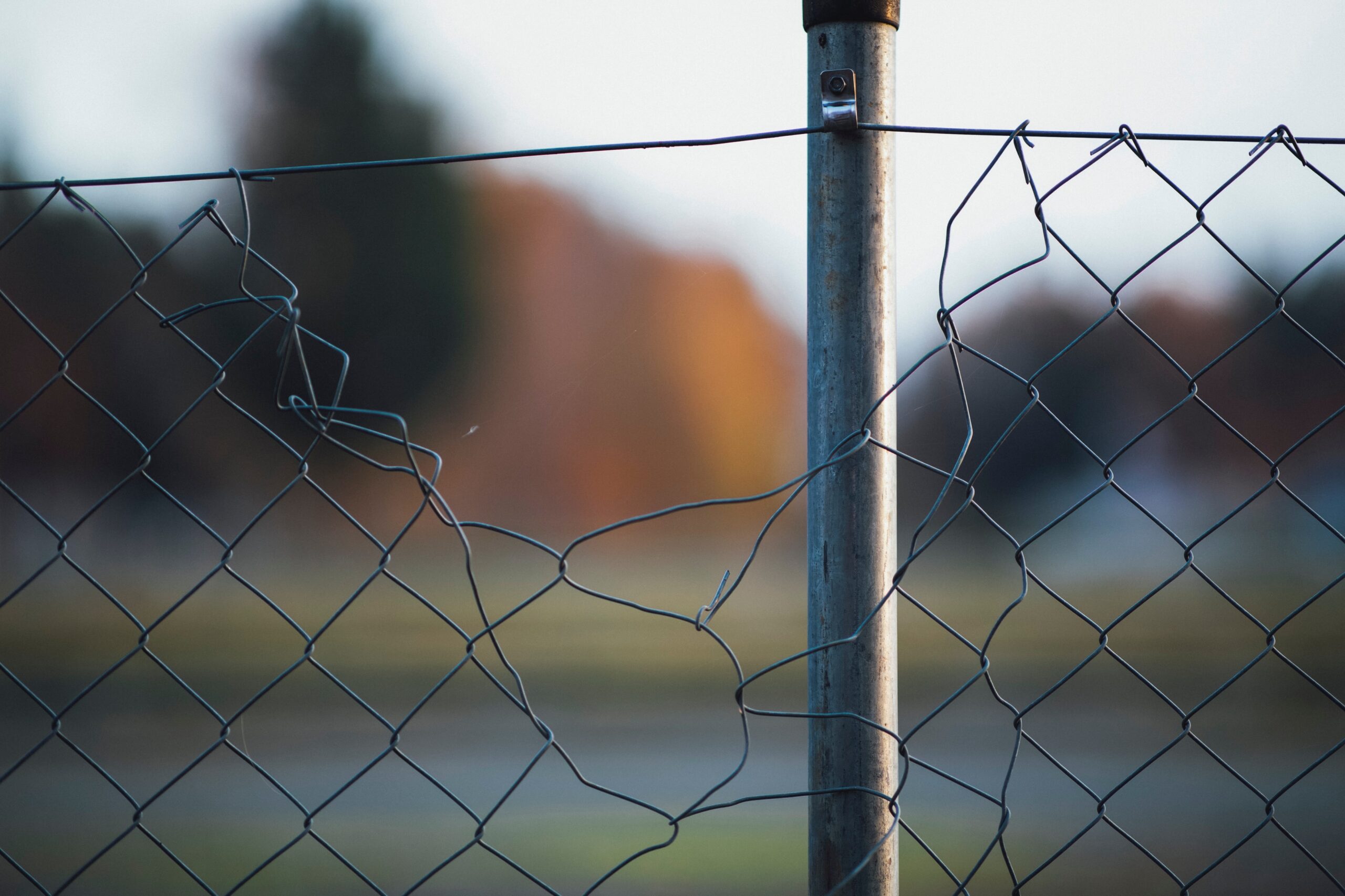 Image of a broken chainlink fence