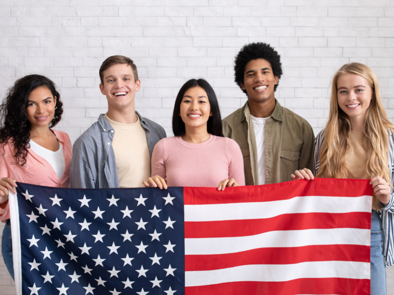 Image of young adults holding an American flag